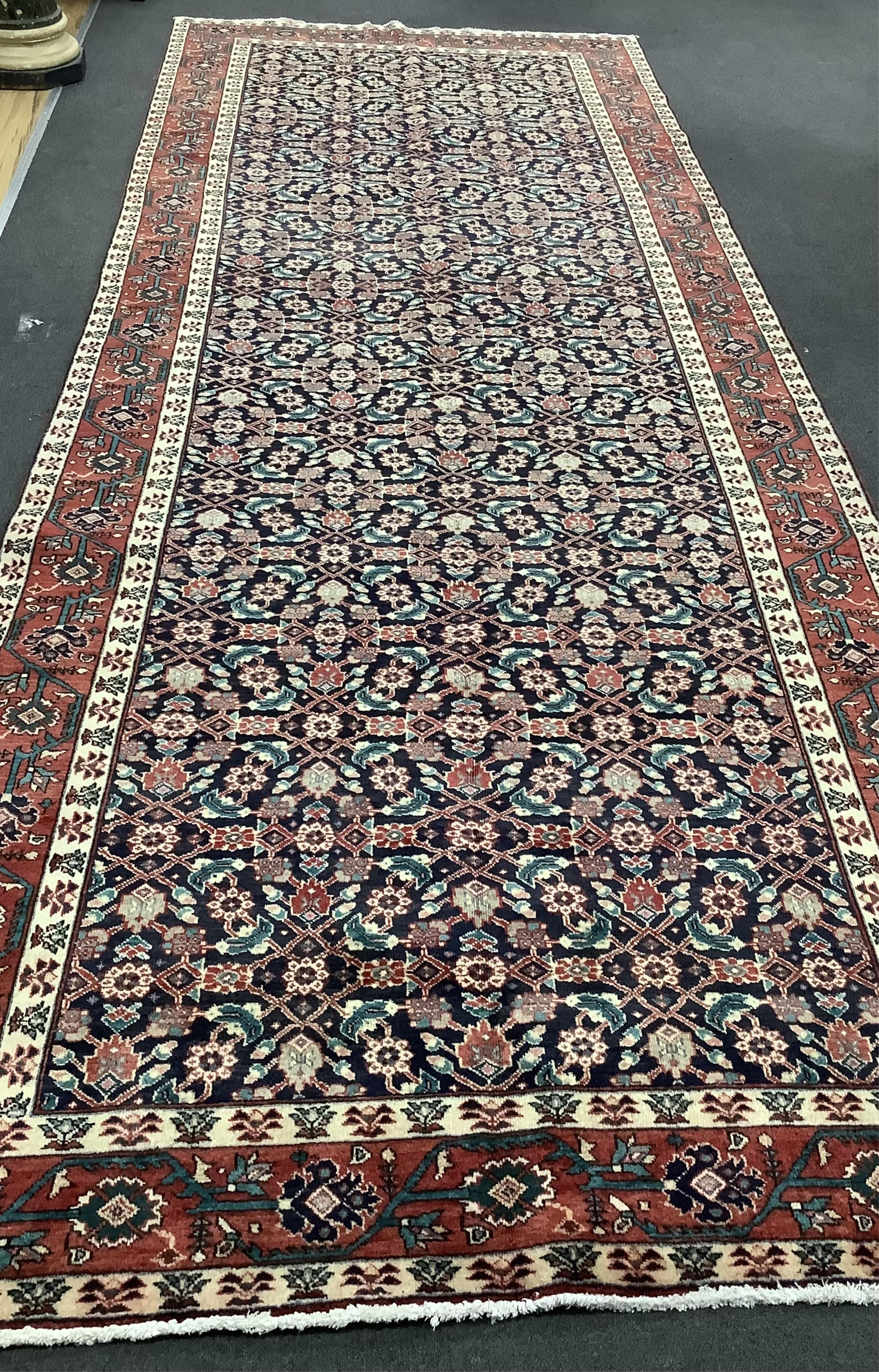 A Hamadan blue ground hall ground carpet, 430 x 160cm. Condition - good